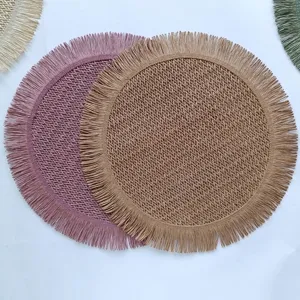 Round paper rope placemat detail showing intricate hollow braided texture and elegant fringe edges.