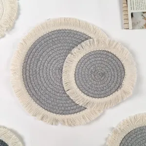 Nordic style round cotton braided heat insulation mat with fringe edge for dining table.