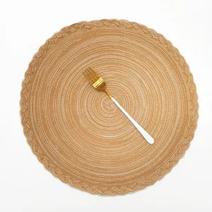 Nordic round woven placemat with elegant braided edge design, perfect for dining table decor.