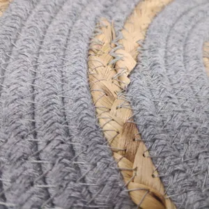 Close-up detail of Nordic woven placemat showing textured grey cotton rope and natural grass.