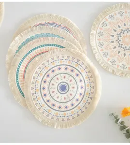 Close-up detail of bohemian round cotton woven placemats with fringe and geometric print