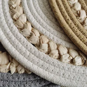 Close-up detail of Nordic style braided cotton and straw rope heat insulation mat.