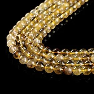 High-quality natural golden rutilated quartz loose round beads for DIY jewelry making.