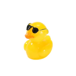 Miniature cute yellow resin duckling figurine wearing black sunglasses for home decor