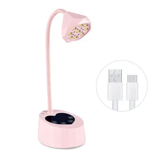 Professional pink lotus-shaped LED nail lamp featuring heart base and USB-C cable detail