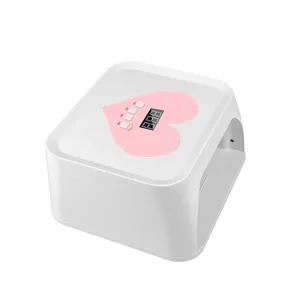Vista superior de lámpara de uñas UV LED blanca con corazón rosa y temporizador