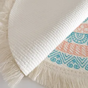 Bohemian round cotton woven placemat featuring intricate printed patterns and fringe details