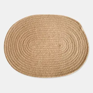 Macro detail view of the oval woven cotton linen placemat with natural fiber texture