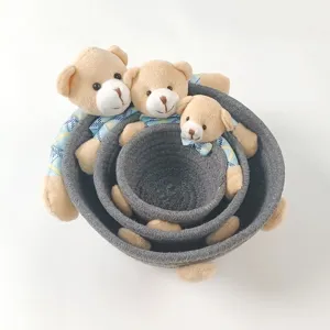 Three-piece set of grey woven rope storage baskets with cute teddy bear plush decorations