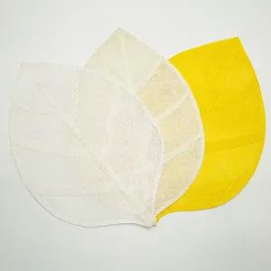 Leaf shaped woven paper placemats detail view, perfect for dining table decor and DIY crafts.