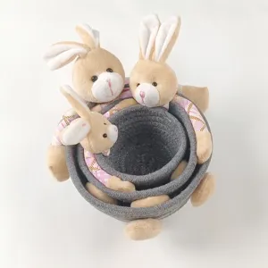 Set of three nested grey woven cotton baskets featuring cute plush bunny accents