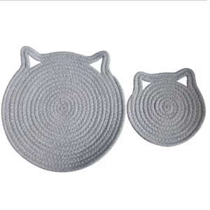 Detailed view of grey cat-shaped cotton rope heat-resistant coasters in two different sizes