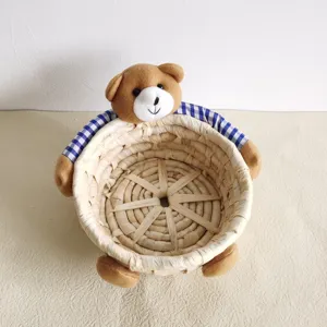Cute corn husk woven storage basket with plush teddy bear decoration for sundries and home decor