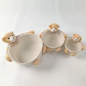 Set of three nesting cotton rope storage baskets featuring cute plush bear decorations