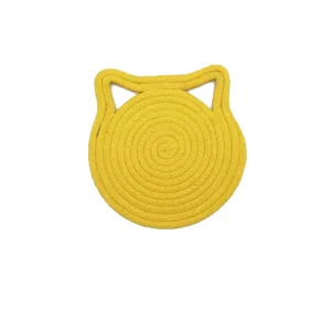 Close-up of yellow handmade cotton rope cat ear shaped heat insulation coaster