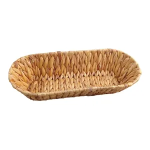 Handwoven natural water hyacinth storage basket for snacks and bread, elegant oval boat shape