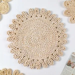 Handcrafted corn husk woven placemat, pastoral flower-shaped heat insulated table mat detail.