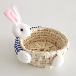 Cute straw woven storage basket with plush bunny, ideal for desktop organization and decor.
