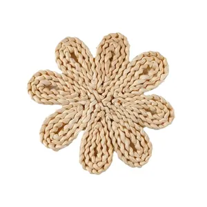 Handwoven straw placemat, rustic floral heat insulation pad for dining table and tea cups.