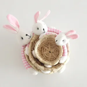Cute straw woven storage basket with bunny plush decor, nested set for cute home organization.