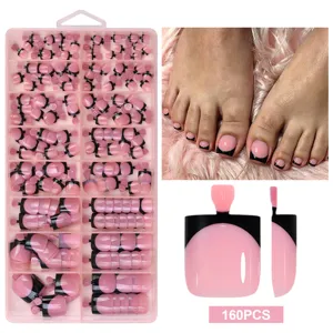 Detailed view of 160pcs French style short pink press-on toenails in storage box