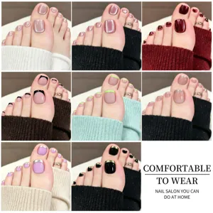 Various styles of French and cat-eye press-on toenails for home DIY pedicure