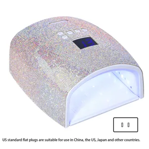 Macro view of 66W rechargeable rhinestone nail lamp featuring a US standard plug