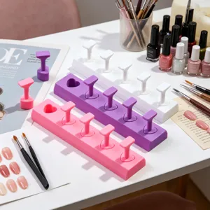 Detail showing heart-shaped nail art practice stands in vivid pink and purple colors