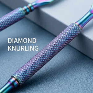 Close-up of diamond knurled handle on rainbow stainless steel nail cuticle pusher
