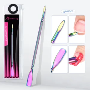 Detailed view of dual-ended rainbow titanium cuticle pusher for professional manicure
