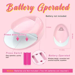 Close-up of portable battery-powered pink nail dryer with size specs and features