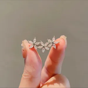 Elegant silver floral brooch with sparkling marquise-cut crystals for dress neckline