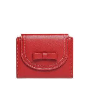 Red women's short bifold wallet with cute bow decoration and white stitching details