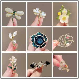 Collection of elegant floral and animal-themed crystal brooches in a collage view