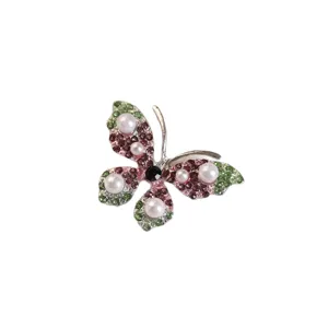 Elegant butterfly brooch with sparkling rhinestones and imitation pearls, white background