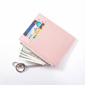 Slim pink leather card holder wallet for women with multiple card slots and zipper closure