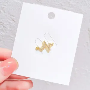Detailed view of exquisite ECG heartbeat rhinestone gold brooch pin sweater accessory