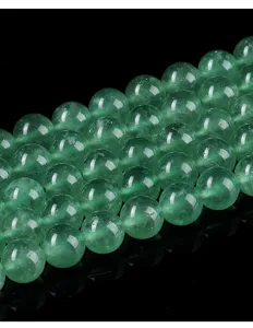 Close-up detail of natural green strawberry quartz 8mm round loose beads for DIY jewelry