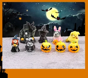 Detailed view of assorted miniature Halloween figurines including witch cat and pumpkins