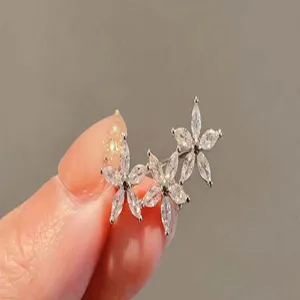 Exquisite triple flower marquise zirconia detail shot, elegant silver tone accessory display.