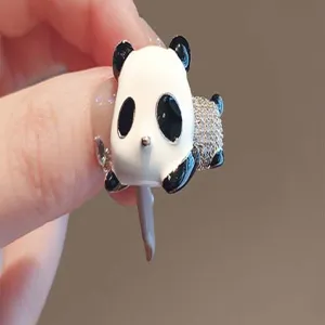 Close-up detail shot of the cute cartoon panda ring featuring sparkling rhinestones.