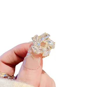 Exquisite crystal flower brooch detail, sparkling rhinestone pin for elegant women fashion.