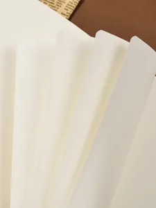 Cream colored refill paper for travel notebooks, premium diary inner pages with smooth writing texture.