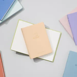 Portable mini pocket notebook for travel, cute cat embossed design, daily notes.
