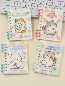 Detailed shot of cute cat spiral notebooks with transparent covers and colorful designs.