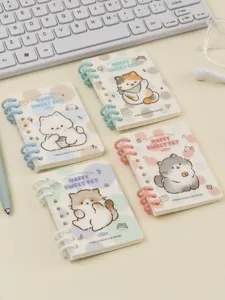 Detailed view of four cute mini ring notebooks with adorable cartoon cat illustrations on covers.
