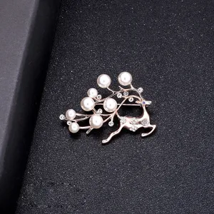 Elegant rose gold reindeer brooch adorned with white pearls and sparkling rhinestones