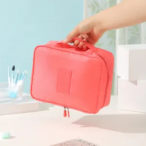 Bolsa organizadora de viaje portátil, neceser cosmético impermeable rosa coral con asa y cremalleras.