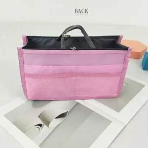 Pink multi-compartment purse organizer detail, lightweight travel makeup storage pouch with double zipper.