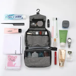Portable hanging toiletry bag with large capacity, multi-compartment travel organizer for cosmetics.
